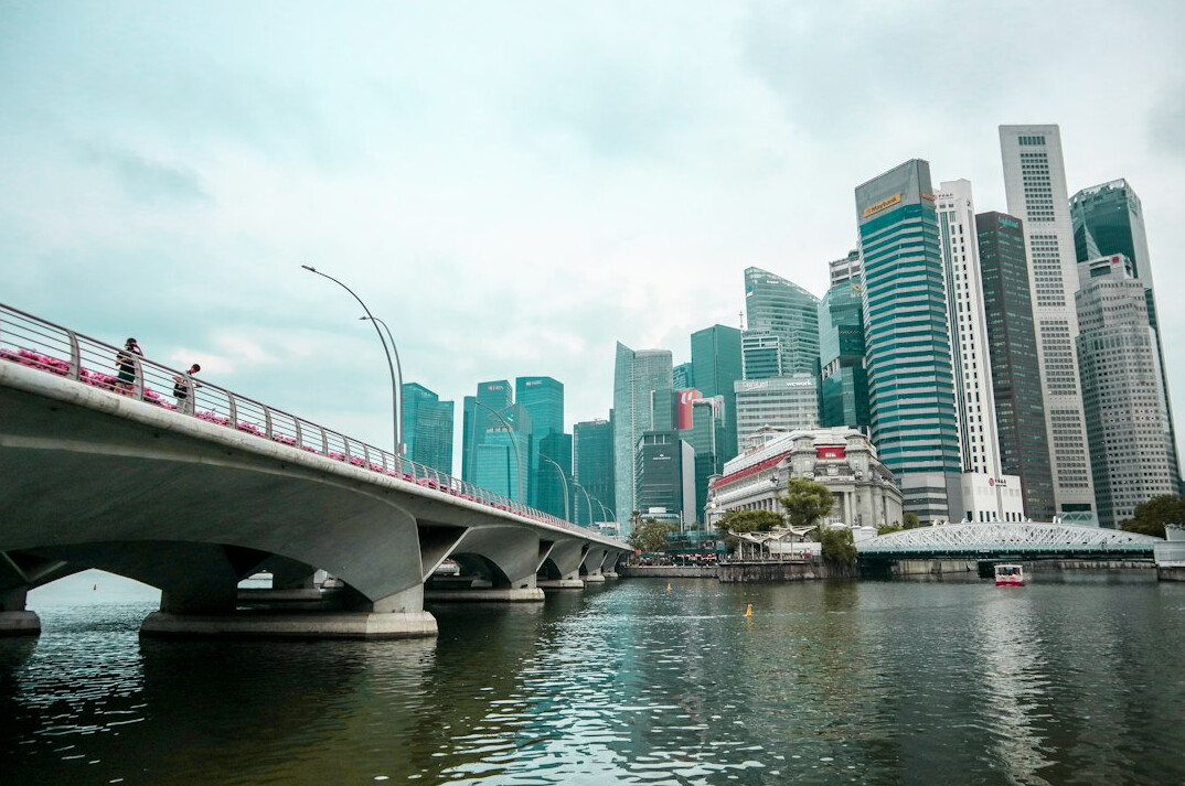 Diverse business team meeting in a modern Singapore law office